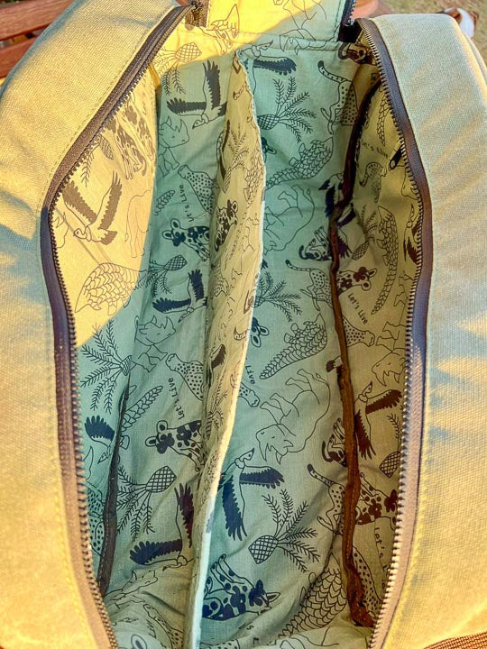 Open Padel bag revealing a patterned interior
