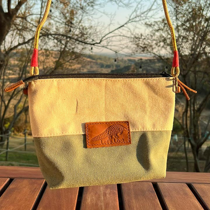 Green and Beige handbag with a leather Let's Live Pangolin patch