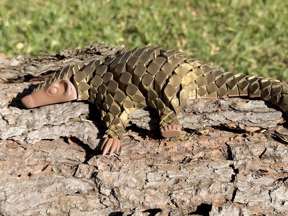 Bronze Let's Live Pangolin Toy on Log