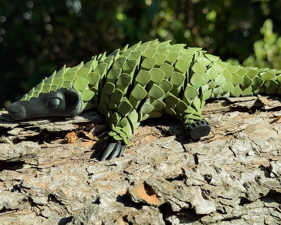 Army Green Let's Live Plastic Pangolin Toy on Log