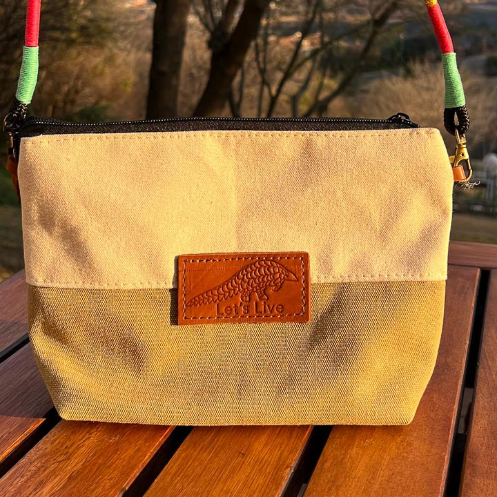 Beige handbag with a leather Let's Live Pangolin patch