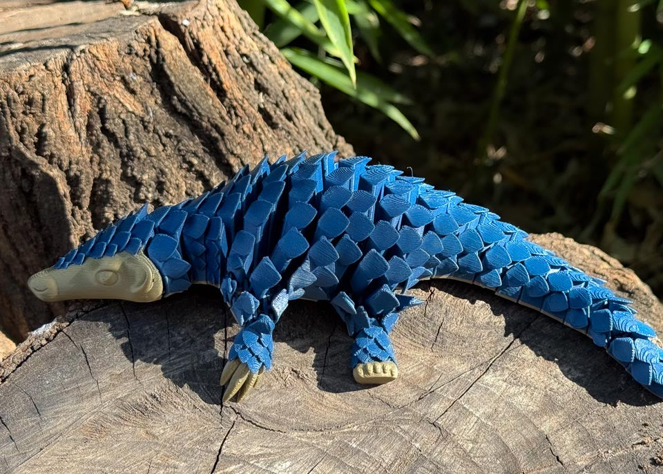 Articulating Blue Let's Live Pangolin Toy on Log