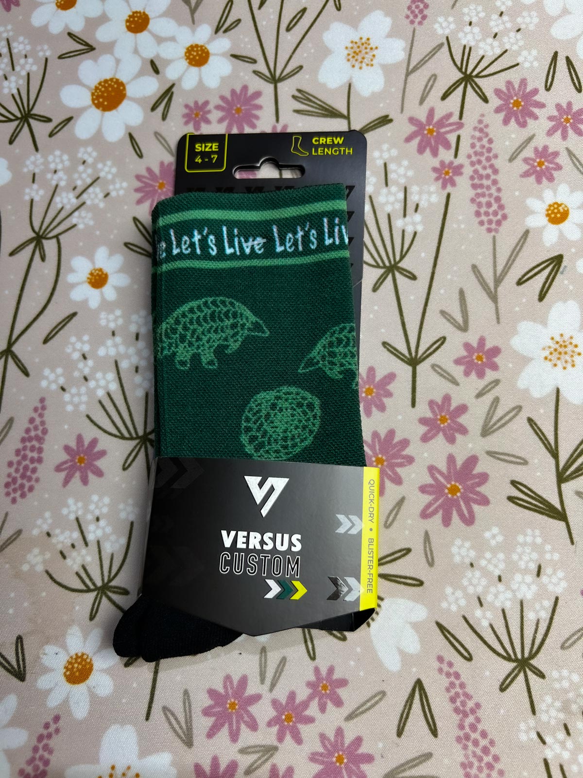 Folded Lets Live Pangolin socks n Versu Custom packaging