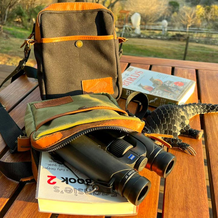 Green and Black Bino Bags with Brown leather trim. Bird books and Binoculars inside
