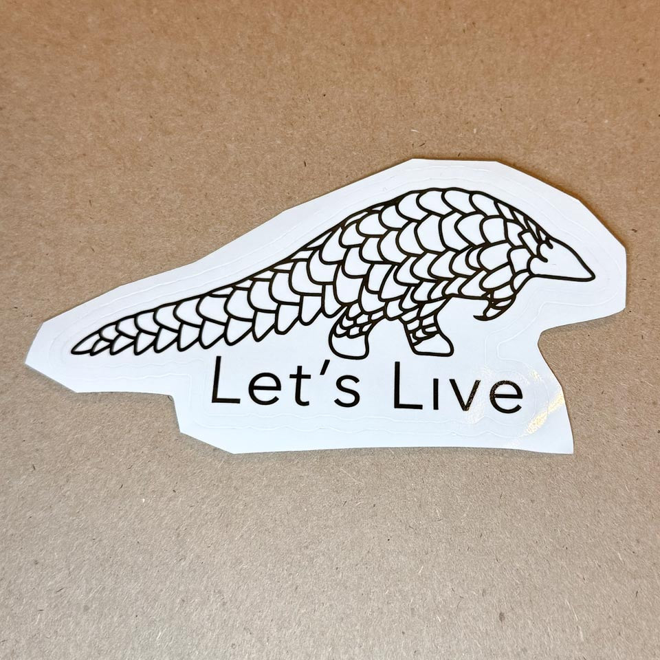 Sticker with pangolin design and 'Let's Live' text on a brown background