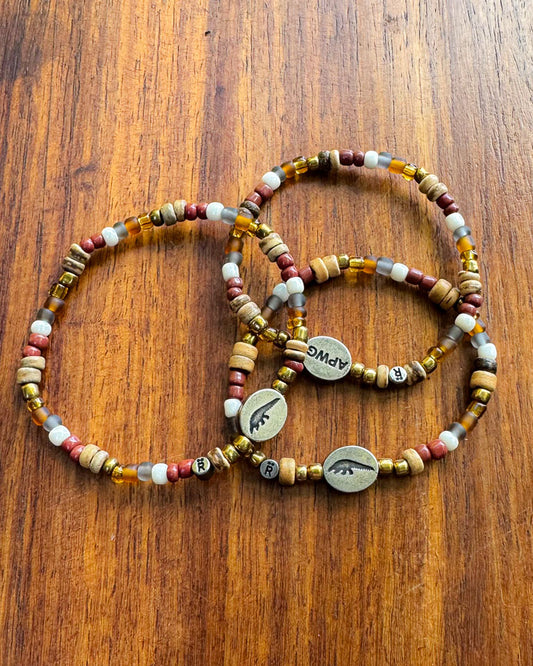 Set of beaded bracelets with Pangolin/APWG engraved charms