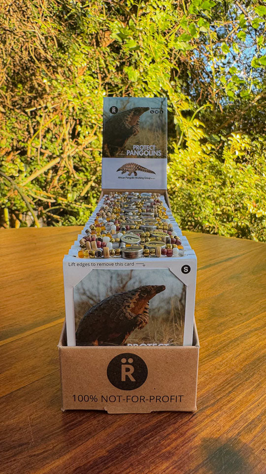 Display of pangolin-themed bracelets that support the African pangolin Working Group