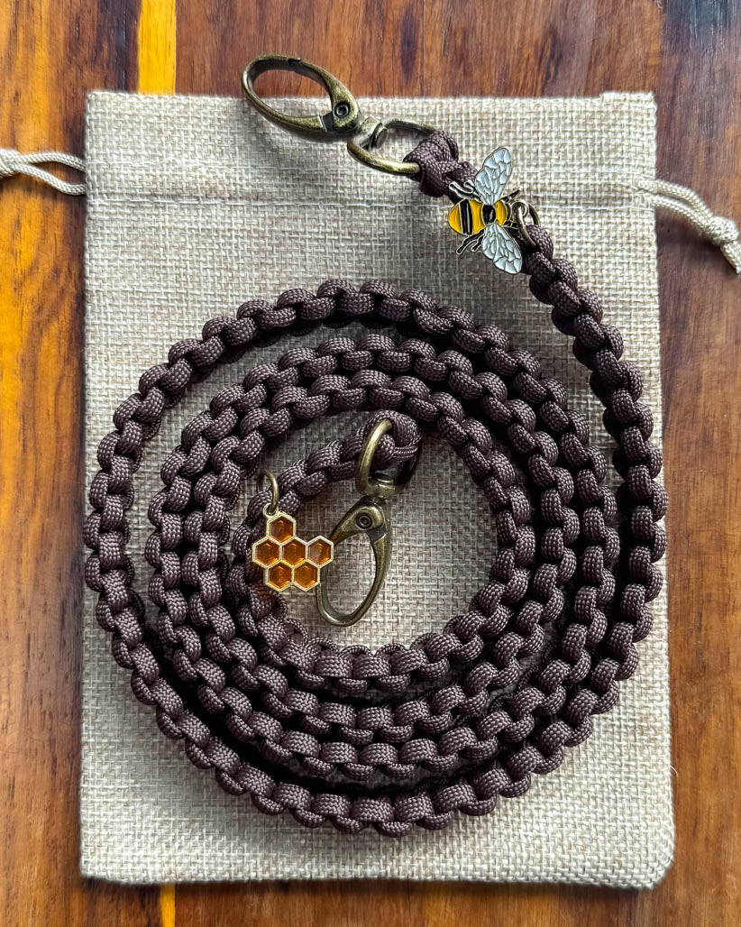 Brown braided paracord with bee and honeycomb charms