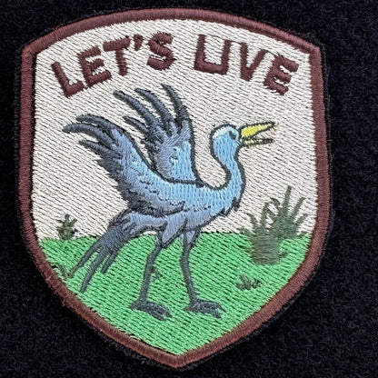Embroidered patch with a south african blue crane design and 'LET'S LIVE' text