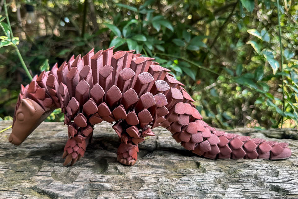 Articulating Pangolin toy in a walking pose