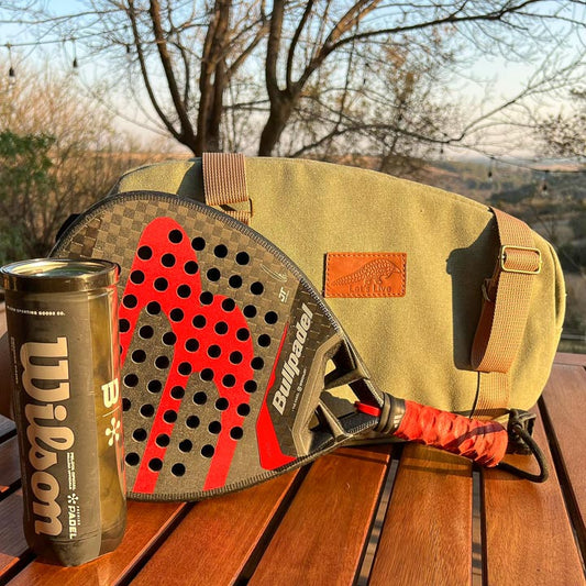 Paddle in front of a green Canvas bag with brown leather pangolin patch