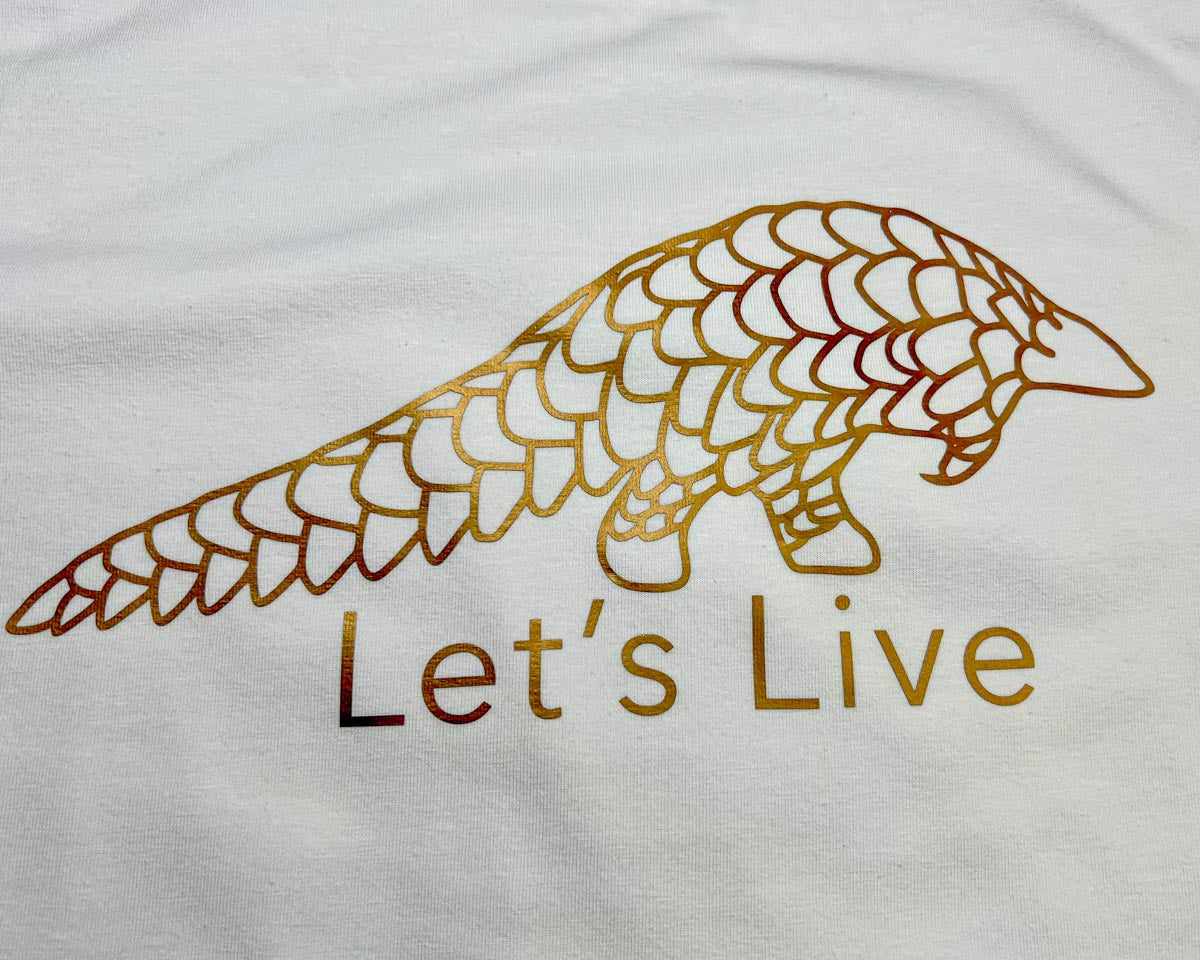 White Lets Live Pangolin Shirt with Bronze Print