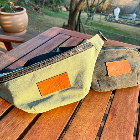 Two canvas waist bags with leather patches