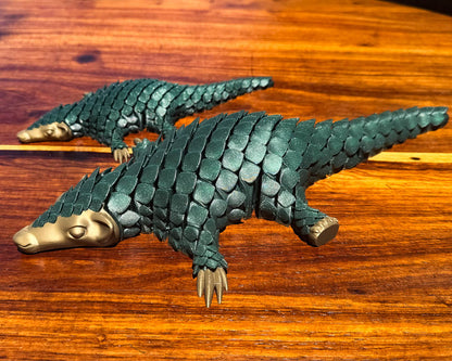 Christmas edition standard and Jumbo sized green pangolin articulating toys