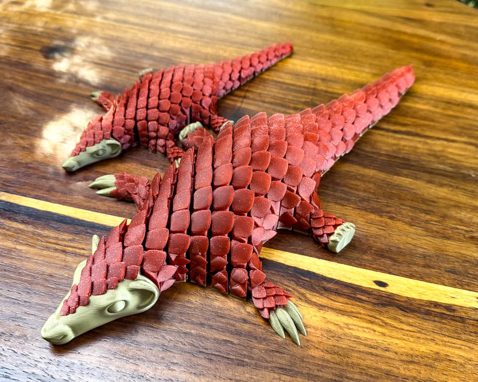 Christmas edition standard and Jumbo sized red pangolin articulating toys