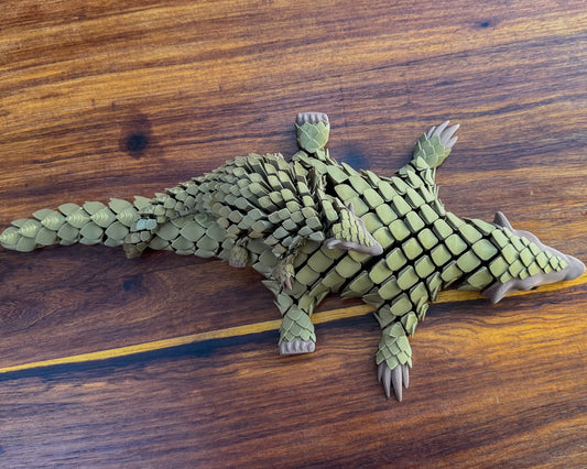 Top view of the standard and Jumbo Let's live Pangolin Toys